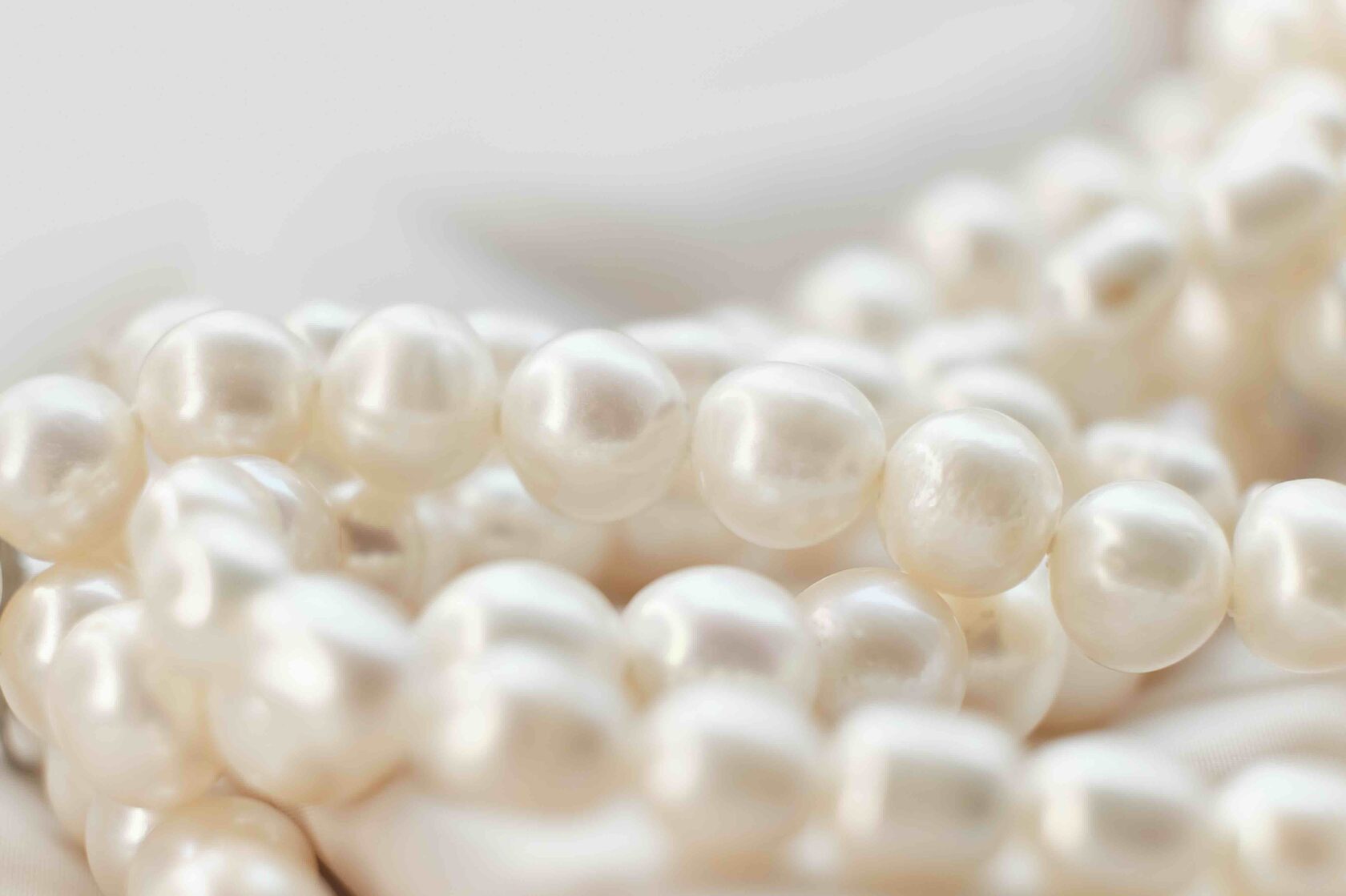 Close-up of cultured white pearl strands